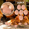 A close-up of realistic plastic hen nesting eggs in various shades of brown and pink, shown next to a hen.