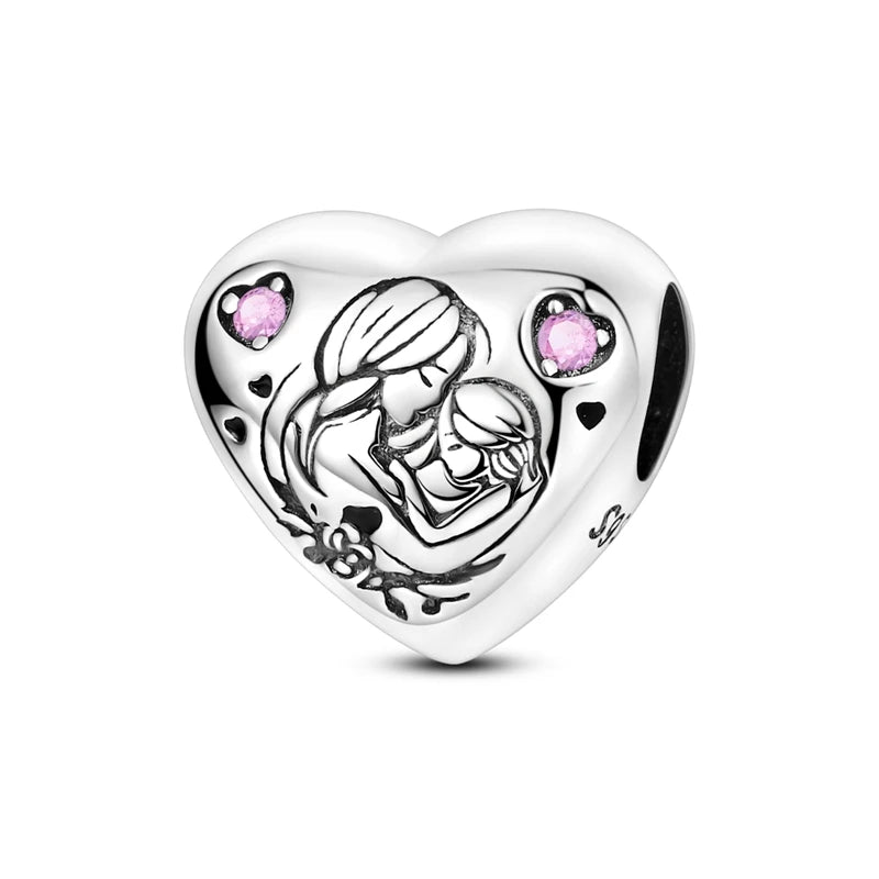 A heart-shaped sterling silver charm bead featuring a detailed outline of two embracing figures and pink zircon accents.