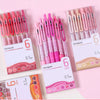 A collection of six pink and red retractable gel pens with 0.7mm tips displayed in clear packaging.