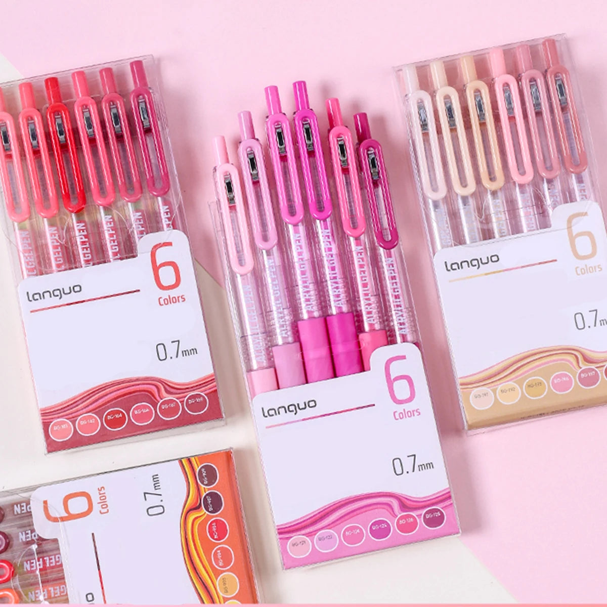A collection of six pink and red retractable gel pens with 0.7mm tips displayed in clear packaging.