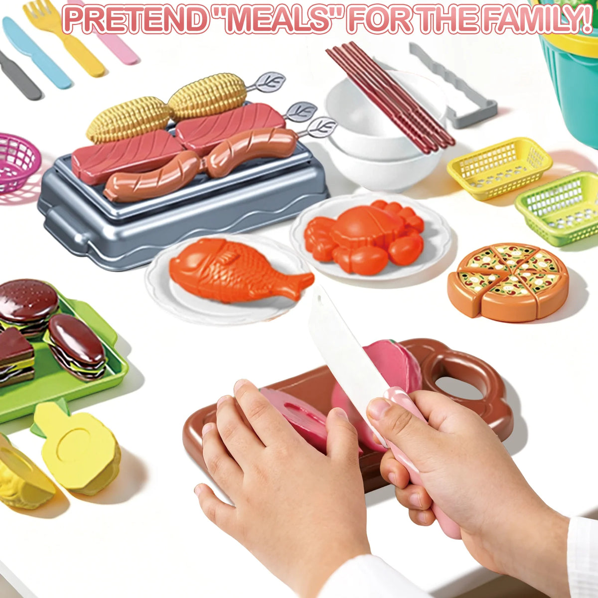 A child's hands are preparing pretend meals using a kids pretend play kitchen set featuring various fruits and cooked meats.