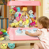 A pink electric toy featuring an assortment of mini animal plush toys with keychain loops.