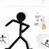 A black wooden sports pose jigsaw puzzle for kids showing a figure in a dynamic stance.
