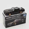 A black Tomica Pontiac Firebird die-cast model car displayed on its packaging.