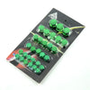 A set of green decorative caps designed to cover motorcycle screws.