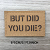 Un patch rectangulaire beige tissé avec du texte noir disant BUT DID YOU DIE?