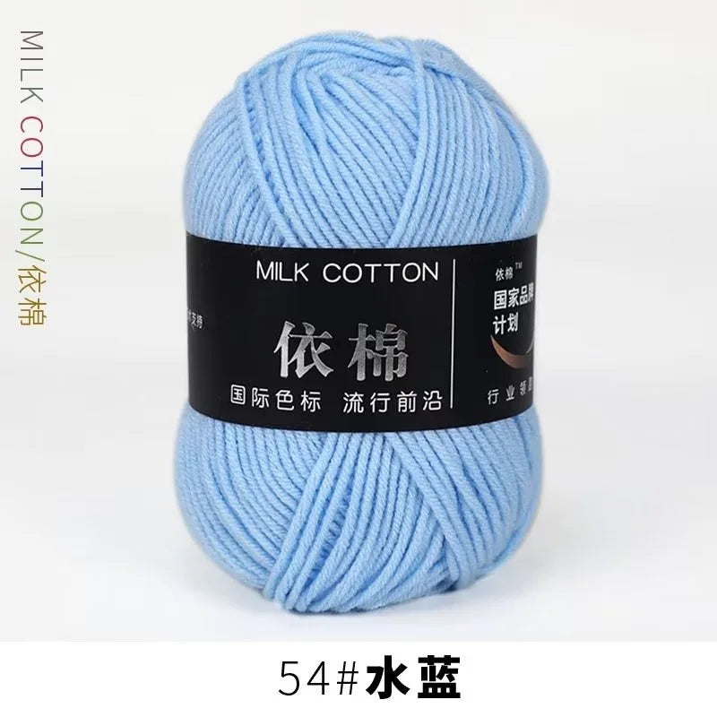 A ball of light blue milk cotton yarn labeled with Chinese characters and a size designation.