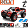 Red and black high-speed 4WD brushless RC monster truck with large tires and a racing setup.