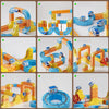 A set of magnetic 3D cube train tracks and flexible components in yellow, orange, and blue.