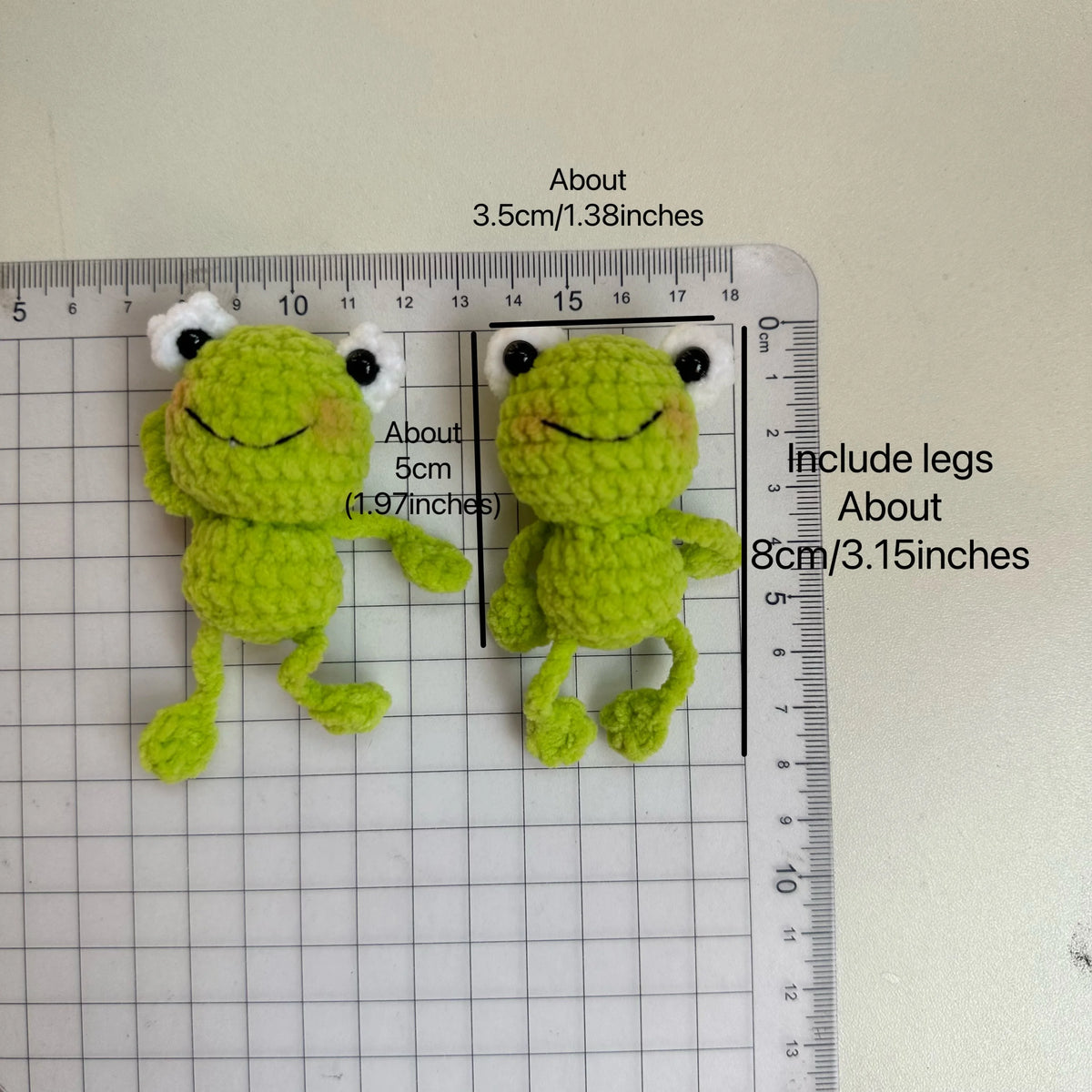 Handmade crochet frog keychain in lime green with white eyes and legs