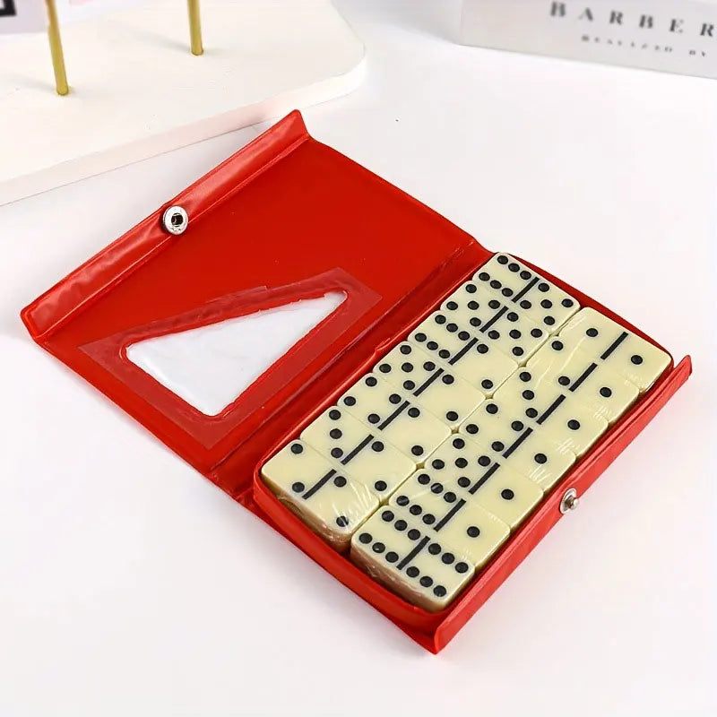 A red box is open, displaying a set of 28 domino tiles with black and white dots inside.