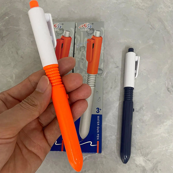 A hand holds an orange and white retractable water spray pen next to its packaging box.