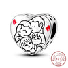 A sterling silver heart charm bead depicting a family of four figures embracing.