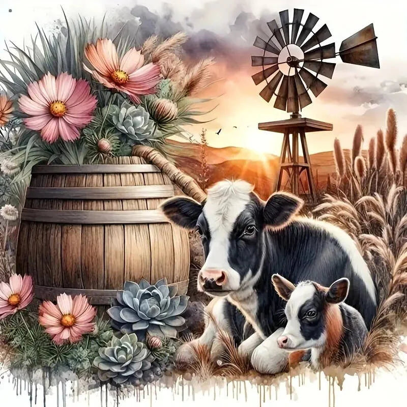 A black and white Highland cow resting in dry grass with flowers and a wooden barrel.
