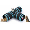 A black and teal foldable S-shaped cat tunnel with hanging ball toys being used by two cats.