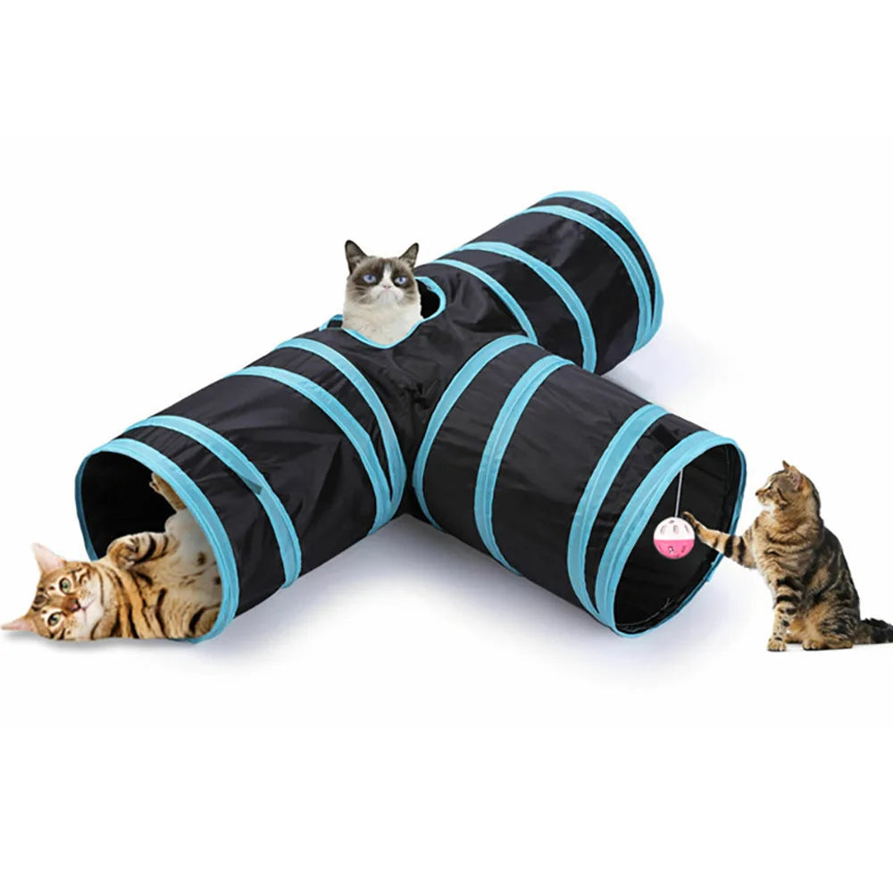A black and teal foldable S-shaped cat tunnel with hanging ball toys being used by two cats.