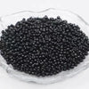 A pile of 2400 glass seed beads in various colors is displayed in a clear dish for jewelry making and crafts.