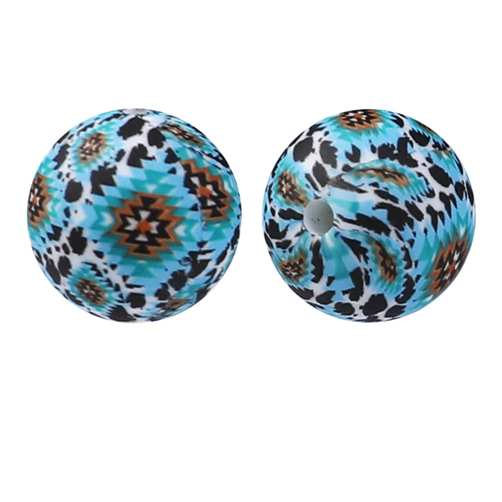 Pair of round silicone beads with a leopard print and teal background for jewelry making
