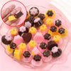 Assortment of pudding-shaped resin pendants in yellow, pink, and dark brown colors for DIY jewelry making