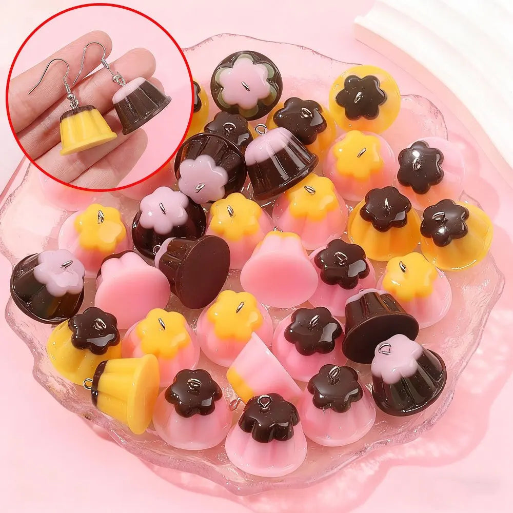 Assortment of pudding-shaped resin pendants in yellow, pink, and dark brown colors for DIY jewelry making