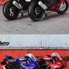 A collection of three die-cast motorcycle models in blue, red, and black colors displayed against a corrugated metal backgrou