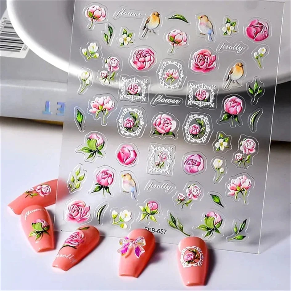 Sheet of 5D bronzing gothic nail art stickers featuring floral and bird designs on a clear background