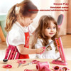 A young girl is using a pink hair styling tool on another child during a house play simulated hairdressing scene.