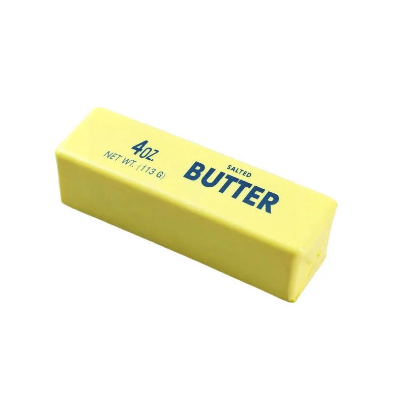 A yellow butter stick with black text indicating 4 oz net weight and salted butter.