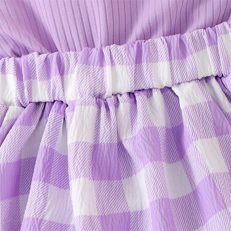 A purple and white plaid romper dress for a baby girl with gathered waist details.