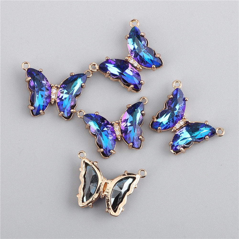 Gold-toned crystal butterfly charm beads with iridescent blue and purple stones for jewelry making