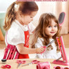 Two young girls play with a pink hair salon role-playing set including scissors and styling tools.