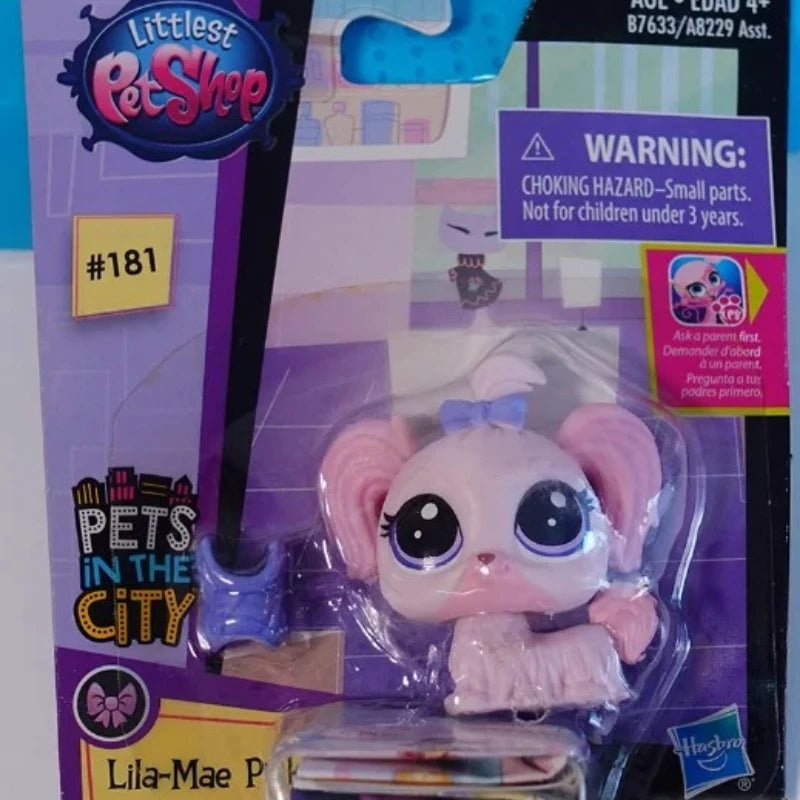 A package of Little Pet Shop mini posable animal figures featuring a pink and white creature.