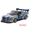 A gray and blue classic rally car building block set with a raised roof.