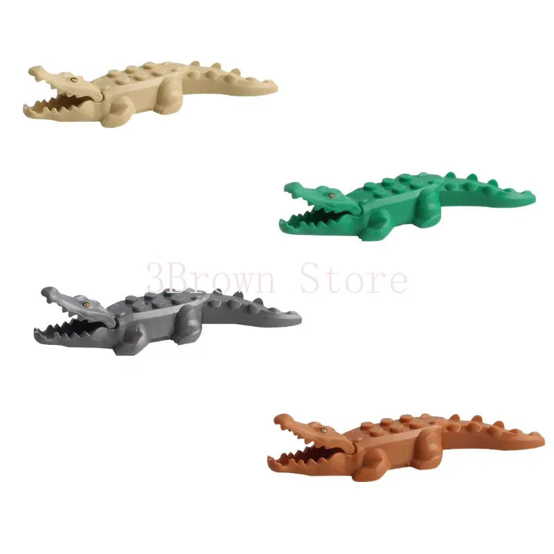 A set of six plastic building blocks shaped like various African wildlife animals, including a crocodile and a lizard.