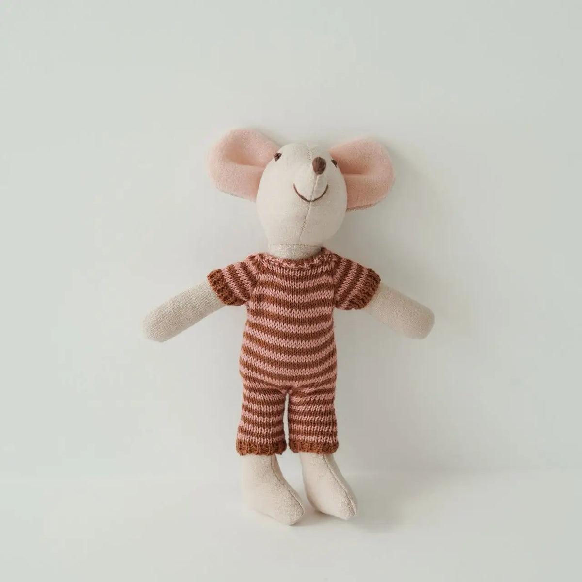 A handmade mouse plush doll with pink ears and a brown striped outfit.