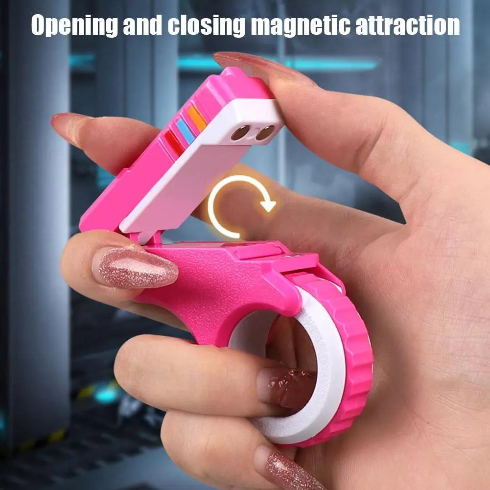 A hand opens and closes a pink magnetic attraction fidget toy with a white ring component.