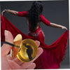 A hand holds a mini copper finger cymbal, with a woman in a red dress performing a dance.