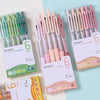 A collection of six pink and green retractable gel pens with 0.7mm tips displayed in clear packaging.