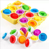A yellow plastic container holds various colored eggs with different shapes for a Montessori matching and sorting toy.