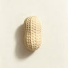 A light beige, oval food-shaped squishy toy with a textured surface.