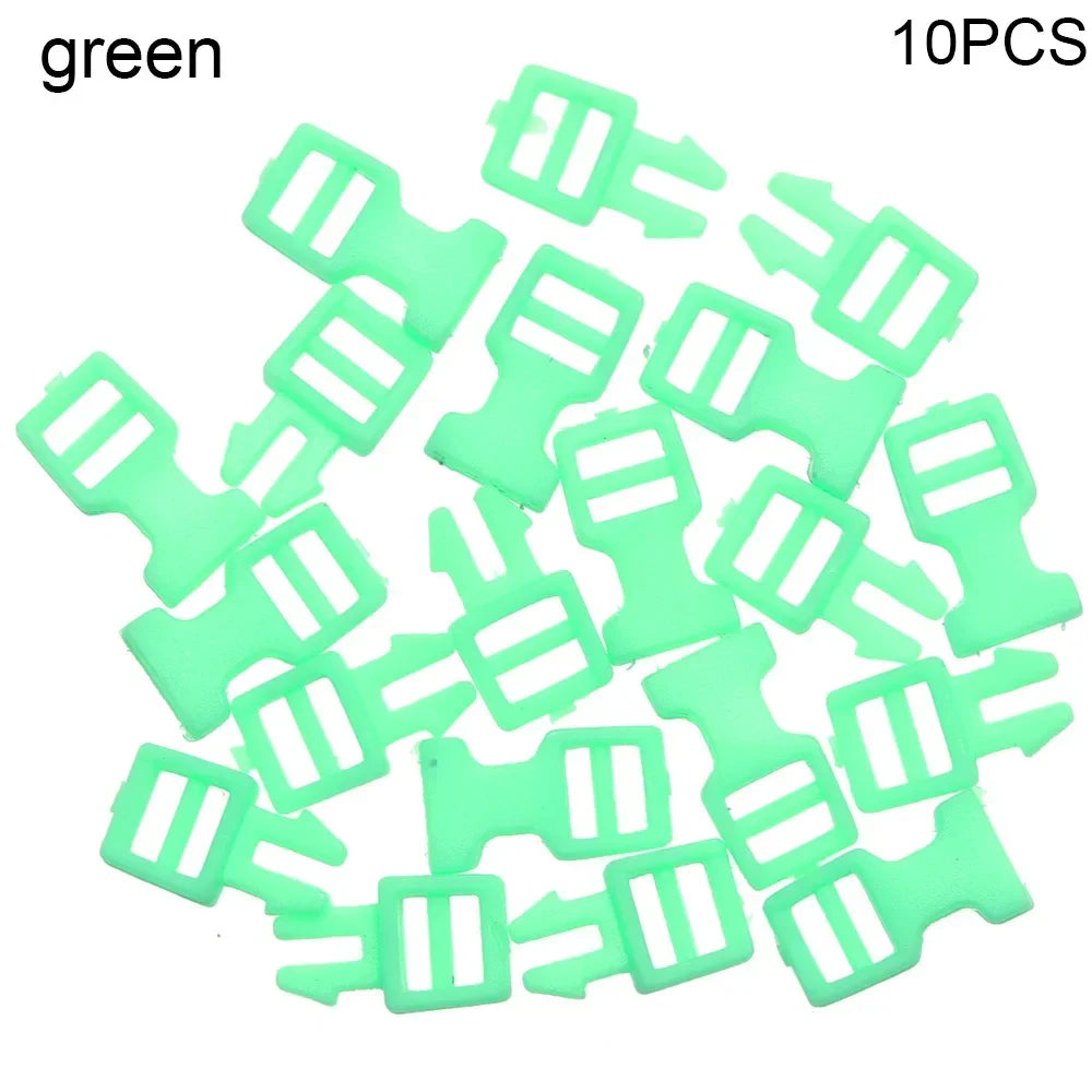 A collection of ten green mini plastic buckles for DIY crafts and outdoor gear.
