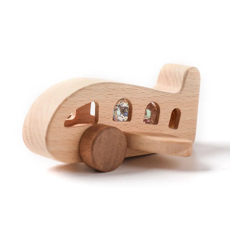 A wooden train toy featuring glass beads as carriages, designed for Montessori educational play.