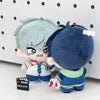 A plush doll resembling a character with light blue hair and blue clothing against a white background.