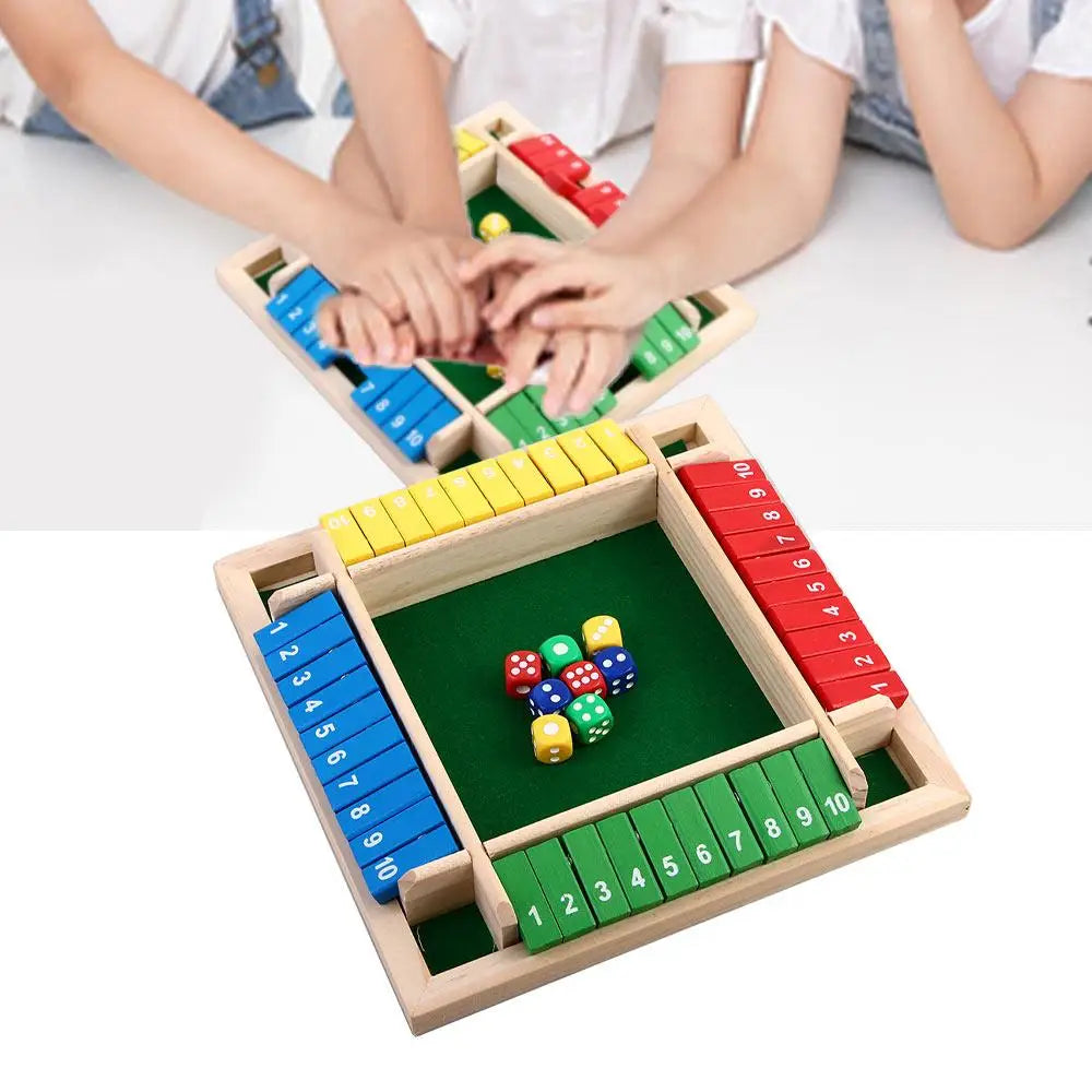 A wooden shut the box dice game with colored dice and numbered wooden blocks for 2-4 players.