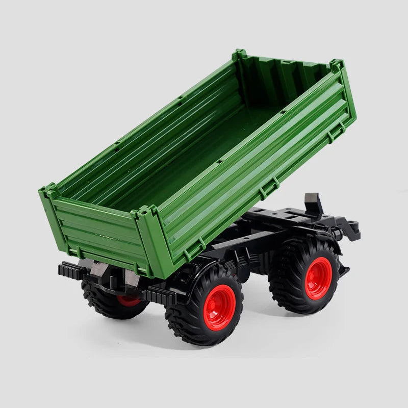 A green remote control tractor with a trailer is shown from above.