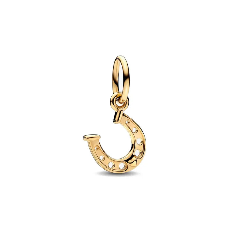 A gold-toned charm bracelet featuring elephant, key, butterfly, and heart pendants.