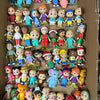 A collection of playful cartoon PVC figurines featuring various characters and designs.