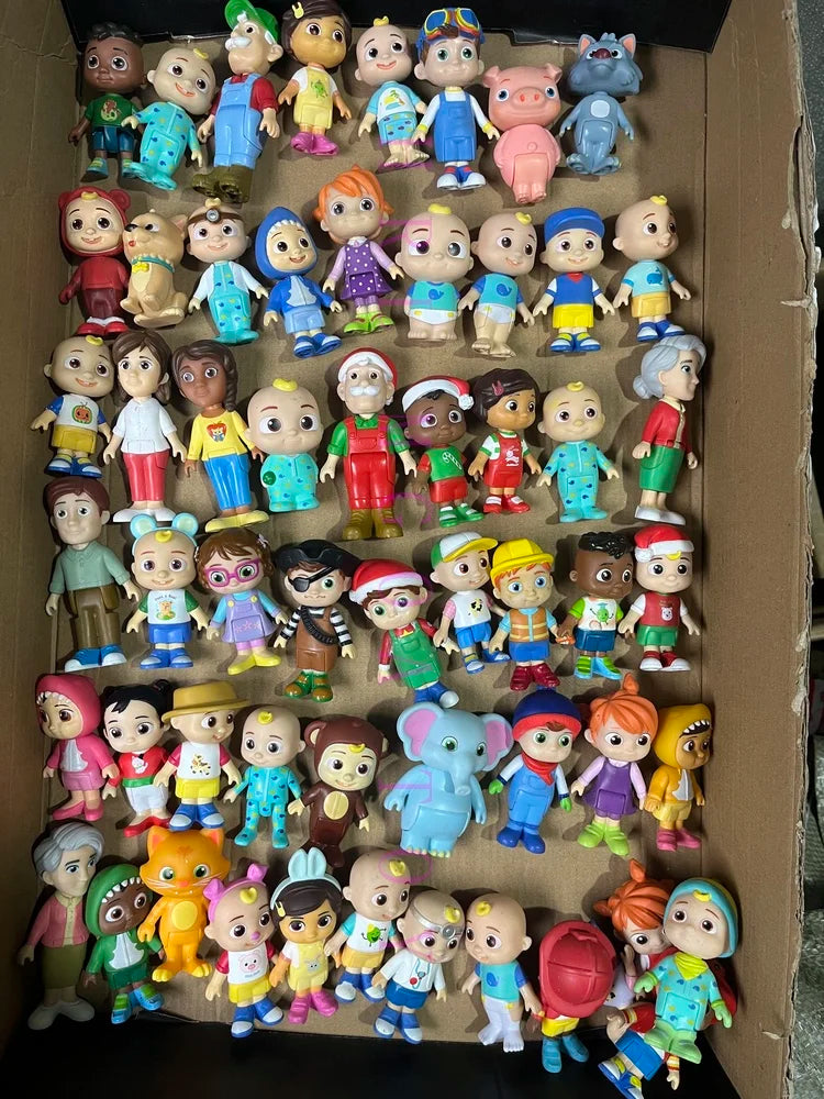 A collection of playful cartoon PVC figurines featuring various characters and designs.