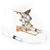 A wooden paddle boat kit with a wooden paddle and clear tubing mounted on a metal stand.