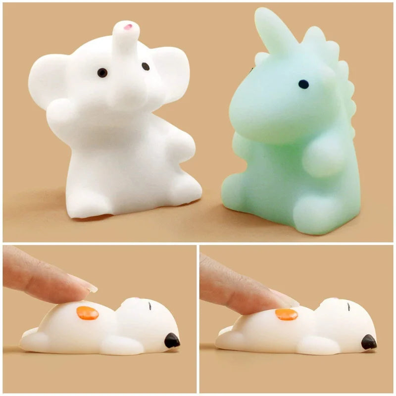 A set of five white and light green squishy animal stress relief toys, including an elephant, a unicorn, and several other cu